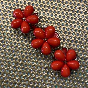 Stretch beaded bracelet in lovely reddish orange floral.